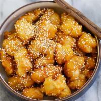 Sesame Chicken · Battered crispy white meat chicken covered in a sweet sesame sauce and sesame seeds.