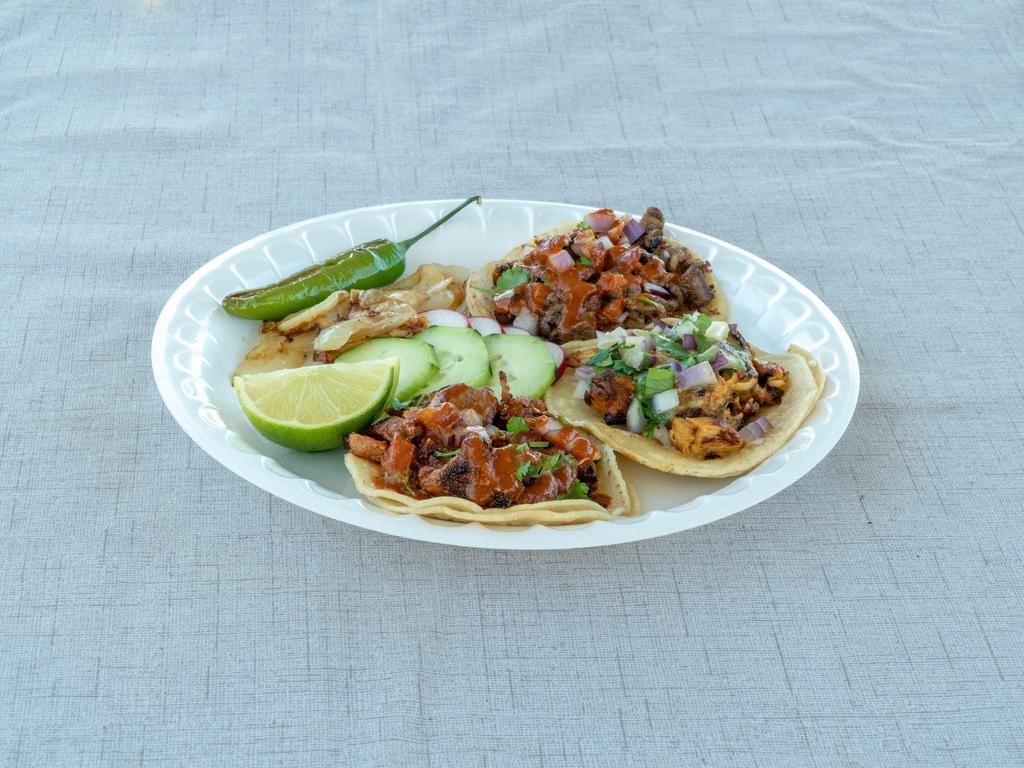 Tacos · Corn tortilla with meat, red onions, cilantro, salsa and grilled onions.