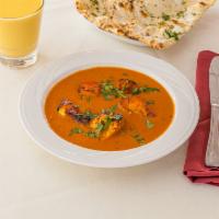 Chicken Tikka Masala · marinated in freshly ground ginger, garlic, and yogurt, baked in a tandoor oven and cooked i...