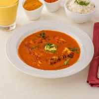 Butter Chicken ·  marinated in freshly ground ginger, garlic, and yogurt, baked in a tandoor oven and cooked ...