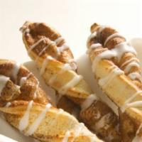 Cinnamon Twists · Our famous twists rolled in a brown and white sugar cinnamon mixture and topped with a delic...