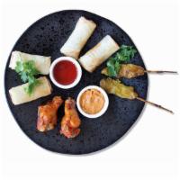Tiffin Box for 2 · Selection of popular starters – with chicken skewers, duck spring rolls, vegetable spring ro...
