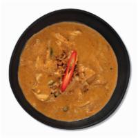 Massaman Curry · A mild and rich curry with potato, onion and crispy shallots. Signature dish. Not Spicy.