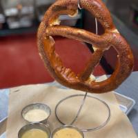 Hangman Pretzel · 10 oz. soft pretzel served with house queso, honey mustard and special secret sauce, BBQ ran...