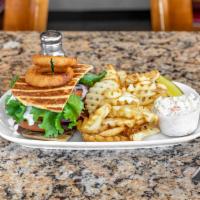 Greek Burger · Our burger topped with sliced gyro meat, lettuce, tomato, onion, and tzatziki sauce on pita ...