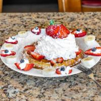 Strawberries and Cream Waffle · Topped with fresh strawberries and whipped cream. Dusted with powdered sugar.