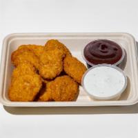 Chicken Nuggets · 9 pieces chicken nuggets served with fries and your choice of sauce. (Vegan)