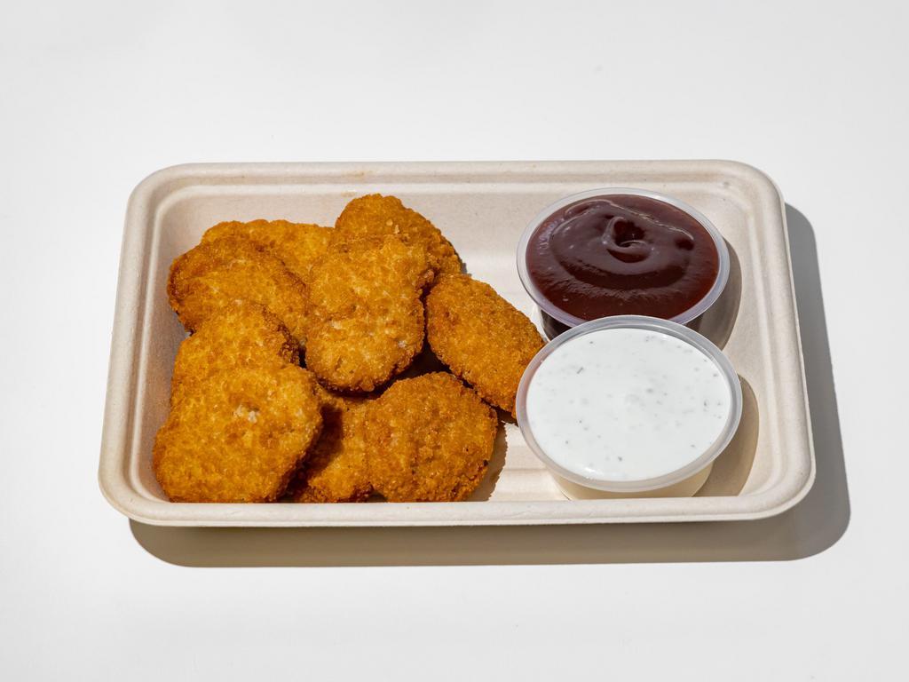 Chicken Nuggets · 9 pieces chicken nuggets served with fries and your choice of sauce. (Vegan)