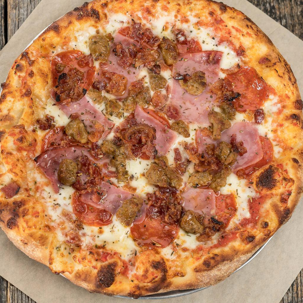 Meaty Beast Pizza · Pepperoni, sausage, bacon & ham. Hand-tossed dough, homemade pizza sauce recipe, 100% whole milk mozzarella.