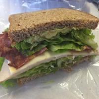 Club Tex Sandwich · Smoked turkey, bacon, pepper jack, ancho lime mayo, lettuce, tomato and onions.