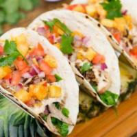 Tacos al Pastor and Choice of Appetizers · 3 soft tacos, pineapple, cheese, achiote sauce, cilantro, lettuce, and guacamole. Served wit...