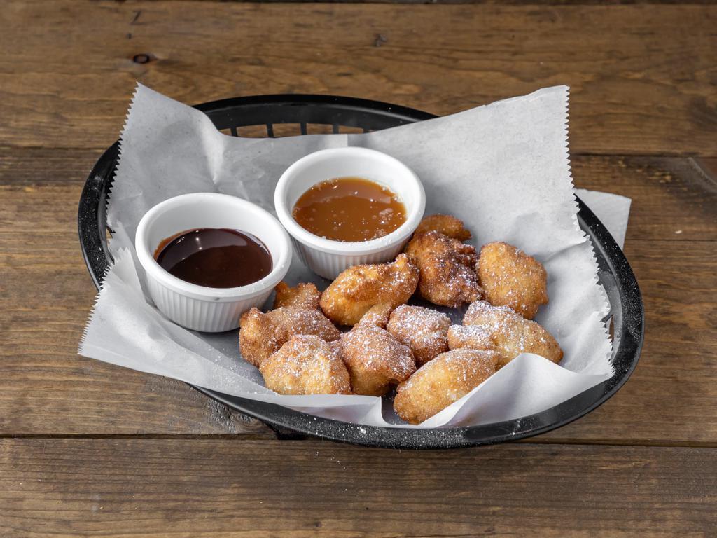 Cinnamon Sugar Zeppole · with chocolate and caramel dipping sauce