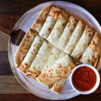 Breadsticks with Cheese · Our pizza dough brushed with garlic butter and Parmesan cheese and topped with Mozzarella ch...