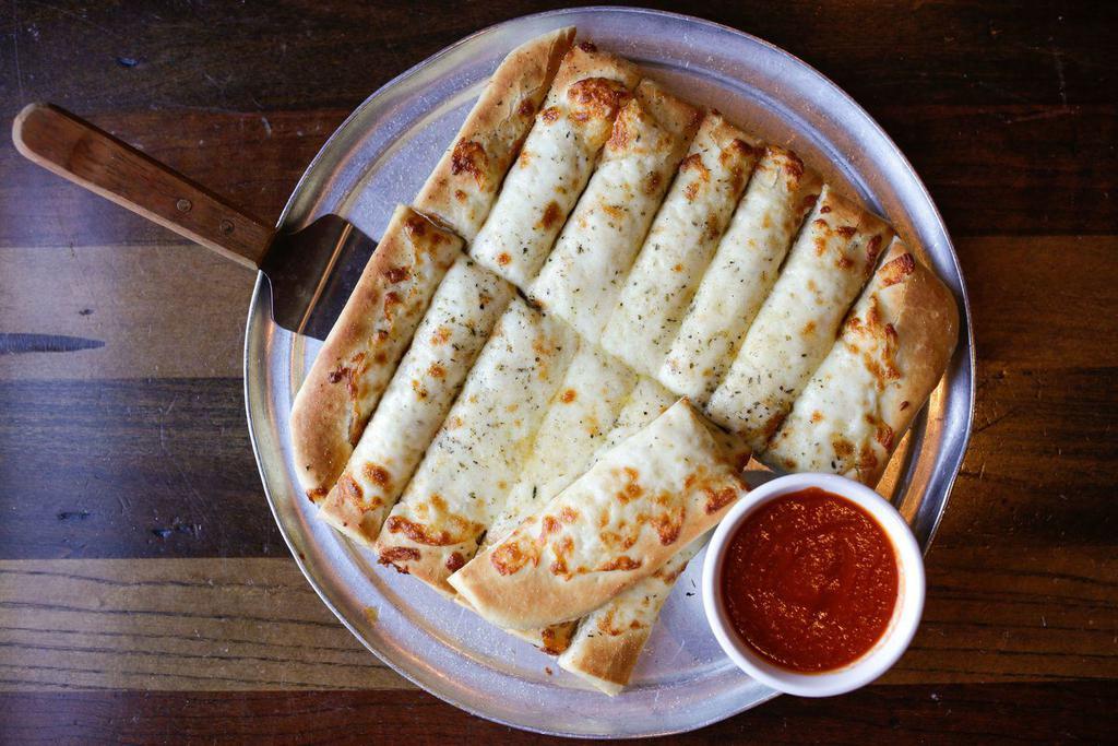 Breadsticks · Our pizza dough brushed with garlic butter and Parmesan cheese.