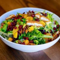 The Julie Salad · Mandarin oranges, Craisins, candied walnuts, and crispy chicken. Served with Poppy Seed dres...
