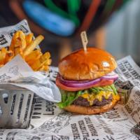 Americana Burger · American cheese, mayo, mustard, lettuce, tomato, and onions. On brioche bun.