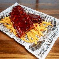 Award-Winning Baby Back Ribs · Served with crispy fries