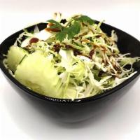 Cabbage Salad Side · Crisp fresh shredded cabbages with cucumber, cilantro, and sweet tangy sesame dressing.