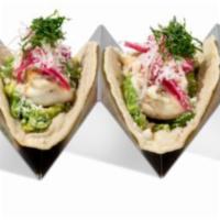 Fish Taco · 2 pieces. Smashed avocado, fish, jalapeño mayonnaise, queso, pickled red onion, radish, and ...