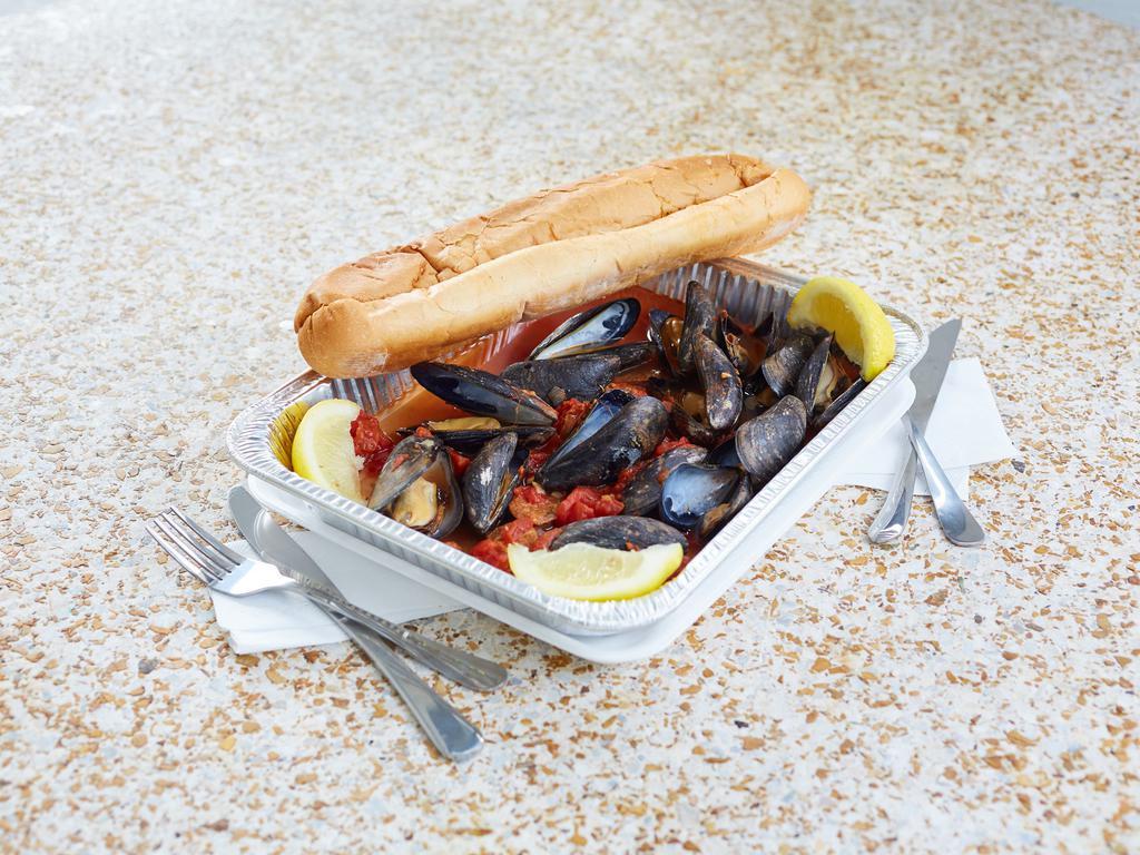 Cassie's Mussels · 1.5lbs of fresh Black Mussels, with Chicken Andouille Sausage, in a zesty and flavorful broth of diced tomatoes, garlic, onions, and white wine. Served with 2 full slices of Garlic Bread.