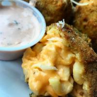 Mac-Nificent Bites · 1 lb of our 4 cheese mac n cheese blend made into balls and tossed in bread crumbs and deep ...