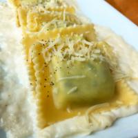 Spinach & Ricotta Ravioli (12 pieces) · Squares of fresh, handmade pasta stuffed with sauted spinach in garlic and combined with cre...