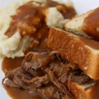 Hot Beef Sandwich · Slow cooked beef with brown gravy and mashed potatoes all in between 2 slices of bread.