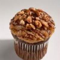 German Chocolate Cake · Rich devil’s food cake topped with caramel coconut-pecan frosting, then drizzled with ganache.