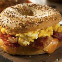 Famous Egg & Cheese Bagel · Toasted Bagel, Egg Cheddar Cheese. 
Add, Avocado & Veggie, Sausage, and Bacon
