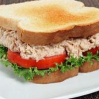 Pacific Tuna Sandwich · Albacore Tuna Salad, Tomato & Lettuce, Fresh Herbs on Sliced Wheat Toast.