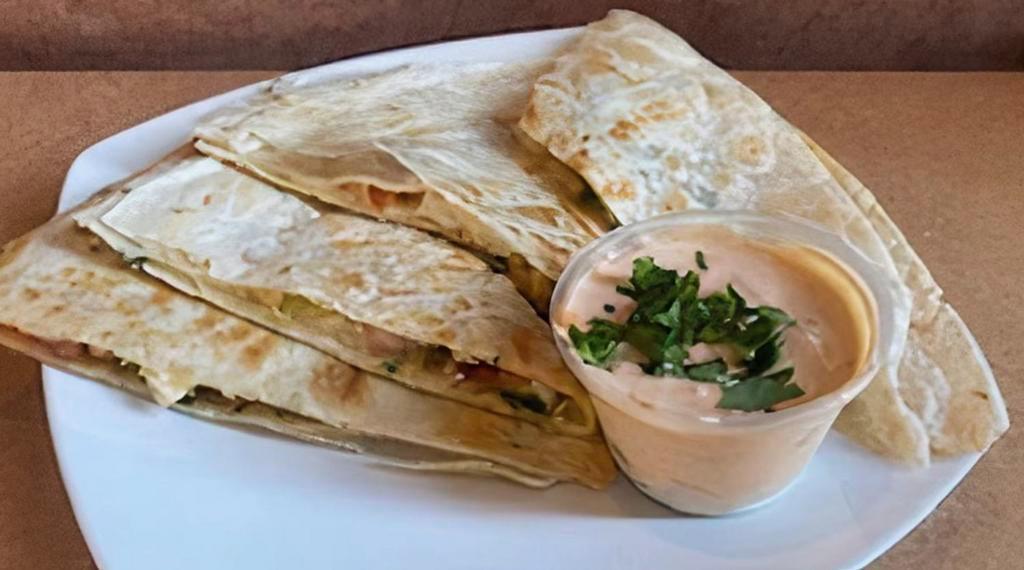Berkeley Grilled Chicken Quesadilla · Grilled Chicken Breast, 3 cheese blend, tomato & diced onions with Mild spicy Signature Sauce on Tortilla.