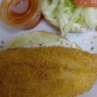 Fish Sandwich w/Side · A Golden Fried Catfish Fillet on a Warm Soft Texas Toast, topped with Shredded Lettuce, Toma...