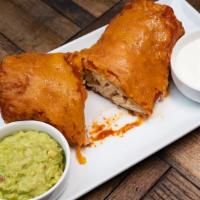 Chicken Chimichanga · Served with sour cream and guacamole on the side. Add Spanish rice and refried beans for an ...