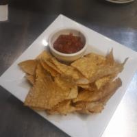 Chips with A Choice  · Tortilla chips with your choice of one: salsa, queso or guacamole.