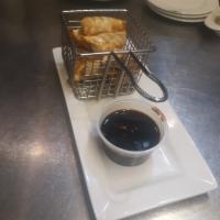 Chicken Pot Stickers  · Served with soy-ginger dipping sauce.
