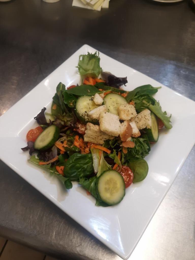 House Salad  · Mixed greens, croutons, tomatoes, shredded carrots and cucumbers. 