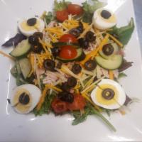 Chef Salad · Mixed greens, hickory smoked turkey, Black Forest ham, hard- boiled egg, black olives, cucum...