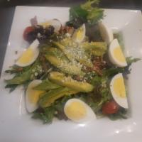 Cobb Salad  · Mixed greens, tomatoes, bacon, hard-boiled egg, avocado and bleu cheese.