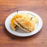 Club Panini · Turkey, ham, spring mix, cheese, tomatoes, honey mustard & ranch sauce. Served with side sal...