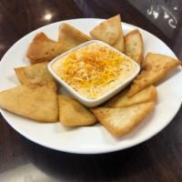 Crab Dip · Our famous blend of secret ingredients with delicious crab meat and served with pita bread f...