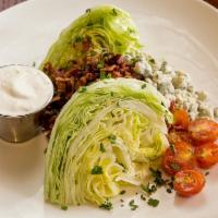 Wedge Salad · iceberg | candied pecans | smoked bacon | tomato | bleu cheese dressing & crumbles