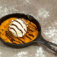 Chocolate Chip Skillet Cookie · chocolate sauce | vanilla ice cream