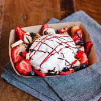 Breakfast Churro Bites · Two cut up churros, topped with strawberries, blueberries, bananas, whipped cream, chocolate...