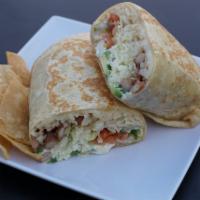 Vegetarian Burrito · Served with rice and beans, grilled carrots and zucchini, onion, cilantro, salsa, cheese, to...