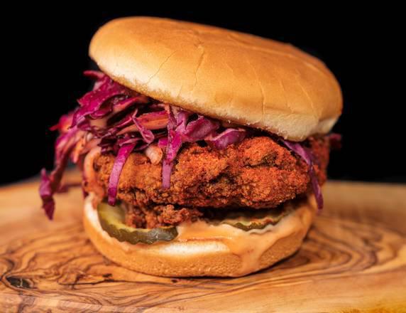 Nashville Hot Chick Sando · 100% Plant Based Fried Chick'n sandwich served with our homemade coleslaw, pickles, secret sauce and seasoned with Nashville Hot Seasoning. 
