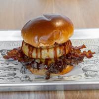 BBQ Bacon Burger · Served on a brioche bun, Tillamook cheddar, BBQ sauce, bacon, & onion rings.
