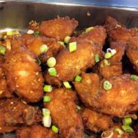 18. Garlic Chicken Wings Special · 3 pieces. Cooked wing of a chicken coated in garlic sauce or seasoning.