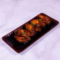 10 Piece Wings · Chicken wings with choice of sauce.