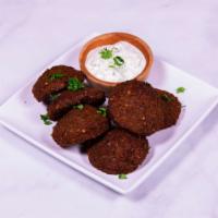 Falafel · Ground chickpeas, vegetables, seasonings and spices formed into balls and deep fried. Served...