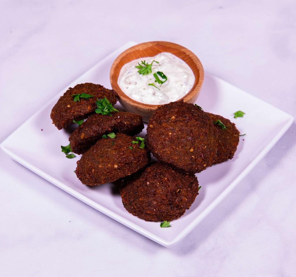 Falafel · Ground chickpeas, vegetables, seasonings and spices formed into balls and deep fried. Served with tahini.